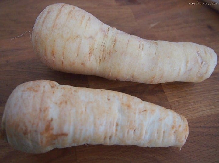 2 large parsnips on a cutting board
