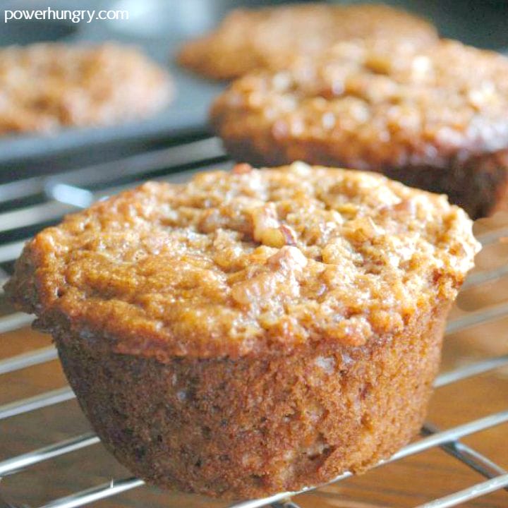close-up of a vegan cinnamon quinoa oat muffin on a cooling rack