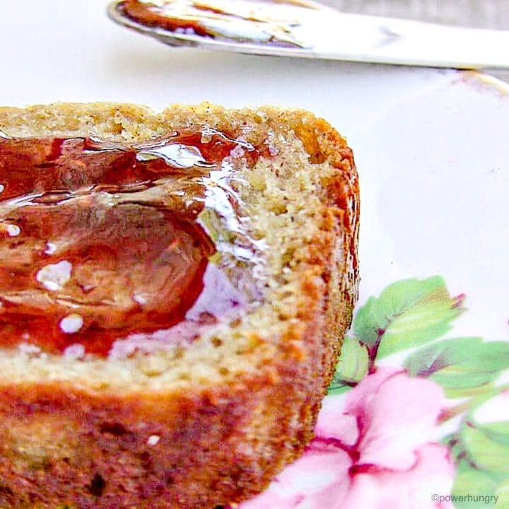 vegan quinoa flour banana bread slice with jam spread on top