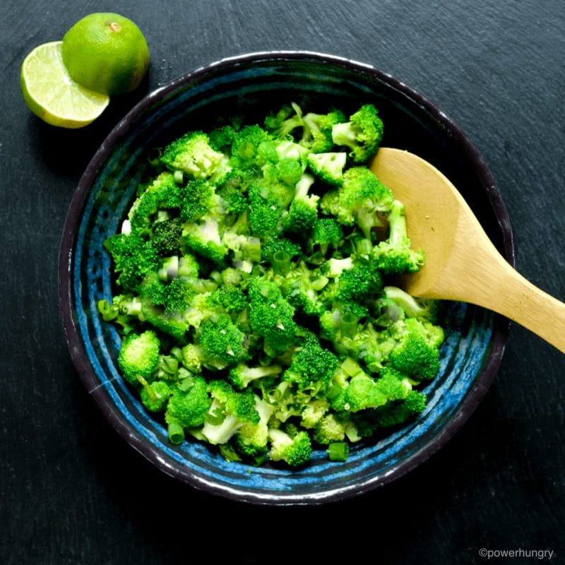 chopped broccoli salad in a blue potter bowl
