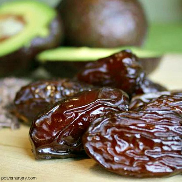 dates and avocado on a cutting board
