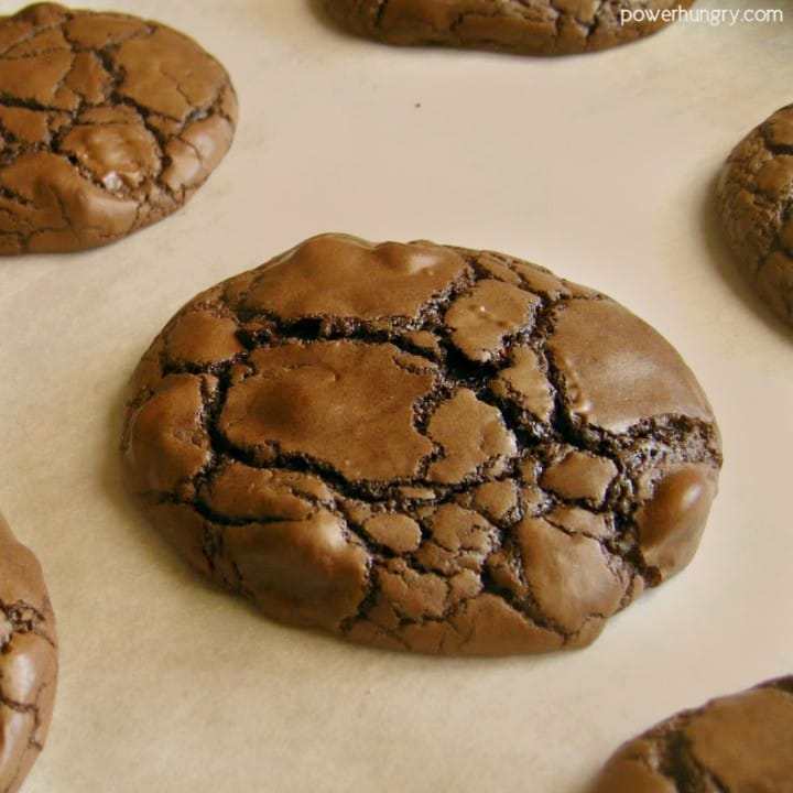 double chocolate cookies , baked, on parchment paper lined baking sheet