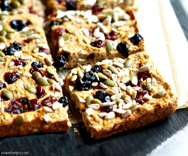 coconut flour and flax breakfast bars, cut into squares on a slate cutting board