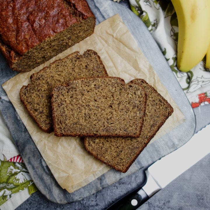 slices of banana bread on a wood cutting board