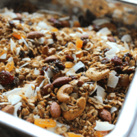buckwheat granola with coconut and fruit on a baking sheet