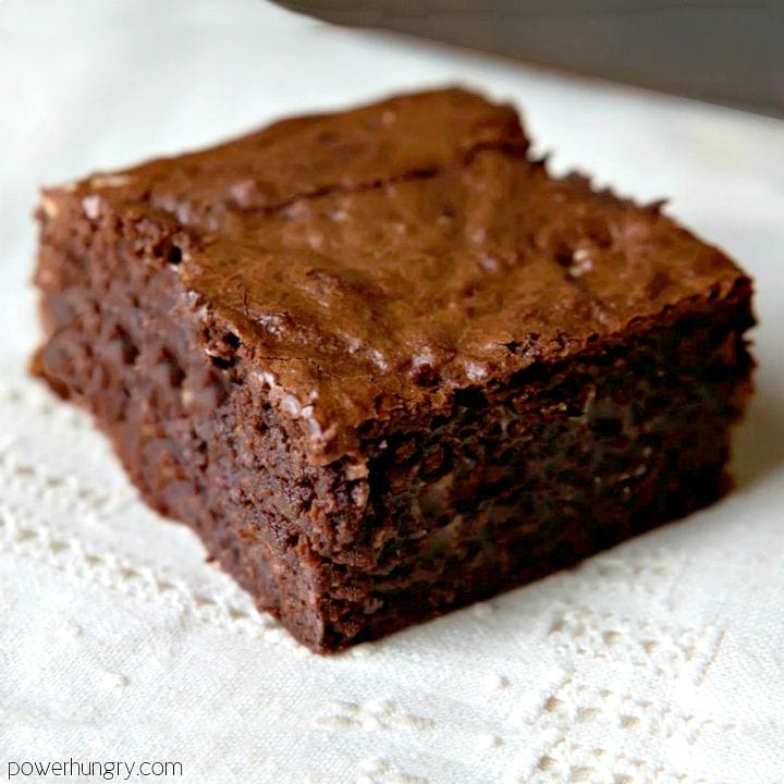 vegan coconut flour and almond butter brownies on a white cloth napkin