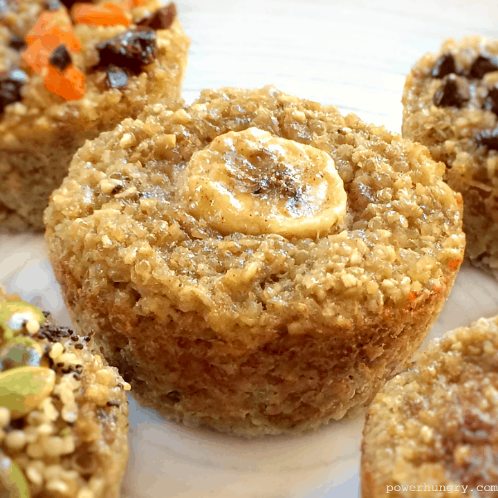close-up of a vegan, oil-free, 3-ingredient banana quinoa muffin on a white plate with other muffins alongside
