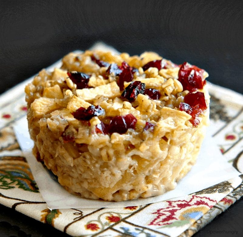 vegan steel cut oats with cranberries and apples, sitting on top a colorful napkin