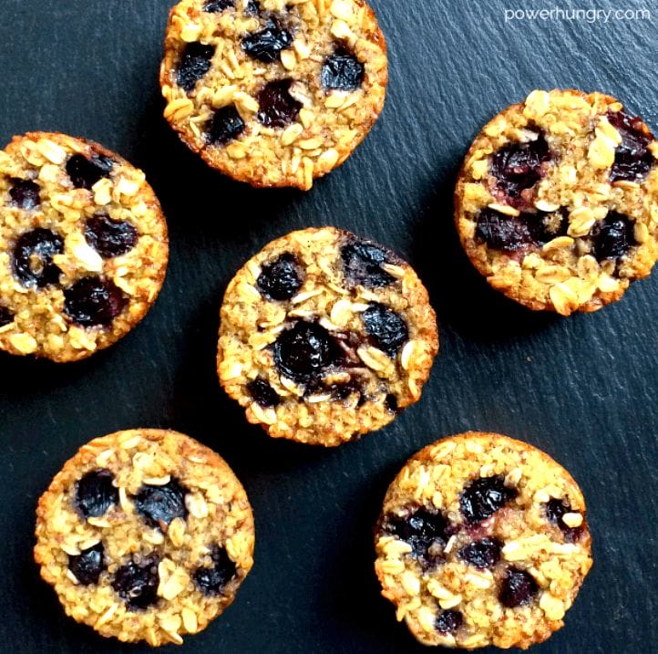 overhead shot of vegan blueberry quinoa muffins on a slate cutting board