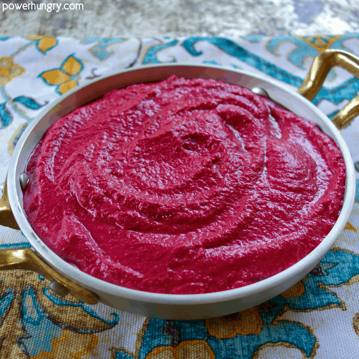 4-ingredient beet hummus in a decorative metal bowl , atop a colorful turquoise napkin