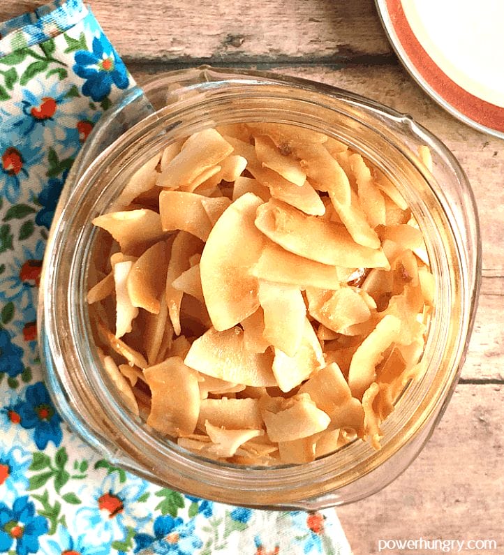baked sweet salty coconut chips in a glass jar 