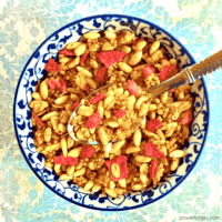 overhead shot of low calorie granola in a blue and white bowl