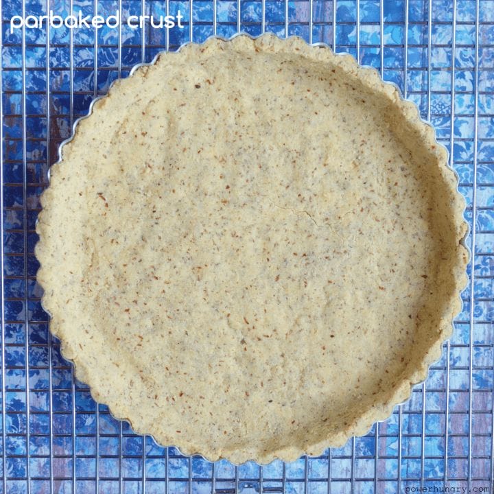parbaked coconut flour-almond flour pie crust on a cooling rack