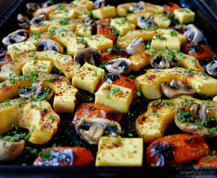close up of acorn squash sheet pan dinner with mushrooms and peppers