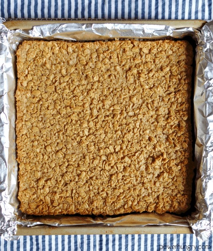 baked Coconut Baked Oatmeal Squares in a foil-lined pan, uncut
