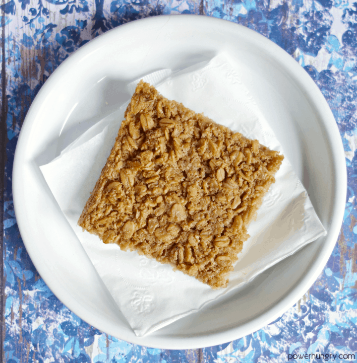 3-Ingredient Coconut Baked Oatmeal Square on a white plate with blue background