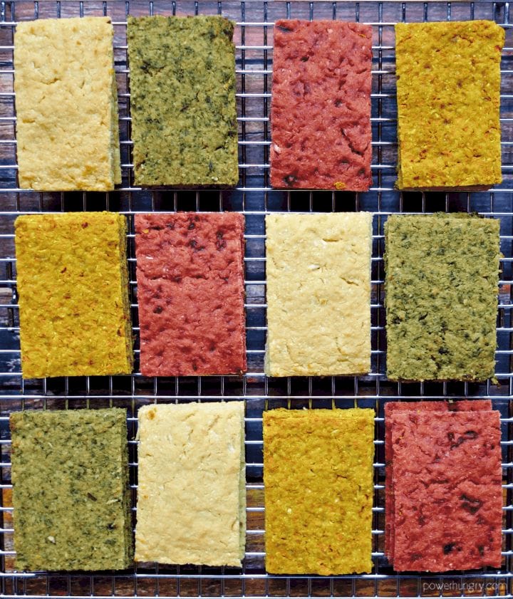overhead shot of assorted 3-ingredient chickpea flour vegetable flatbread on a cooling rack