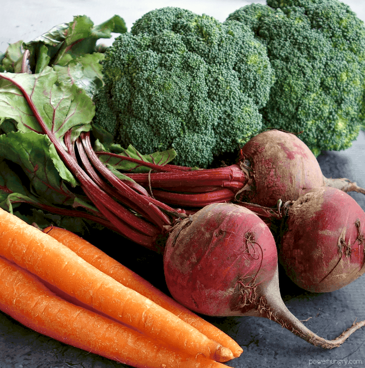 close up of carrots, beets, and broccoli