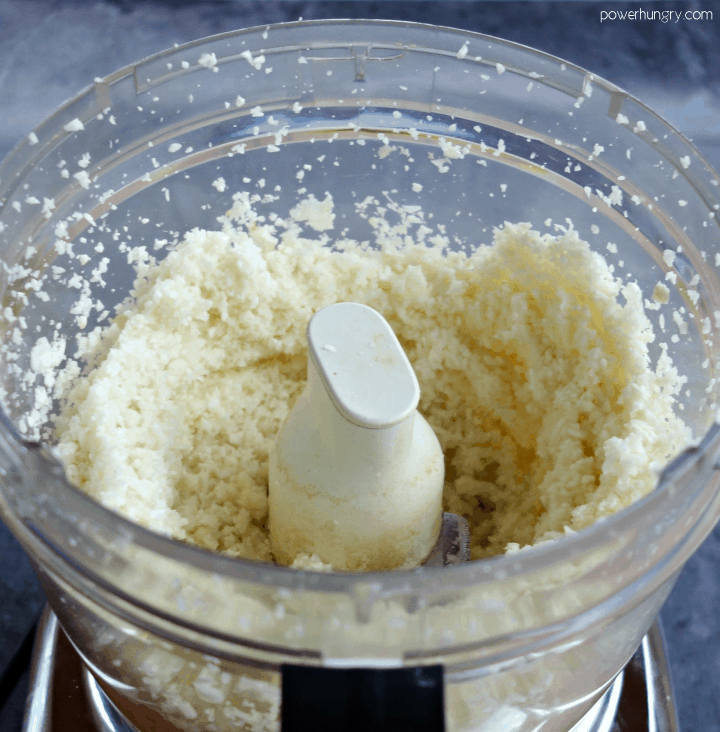 food processor filled with finely chopped cauliflower