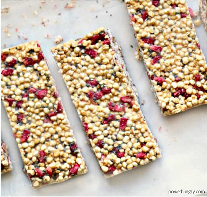 vegan and nut-free strawberry millet bars on a piece of white parchment paper