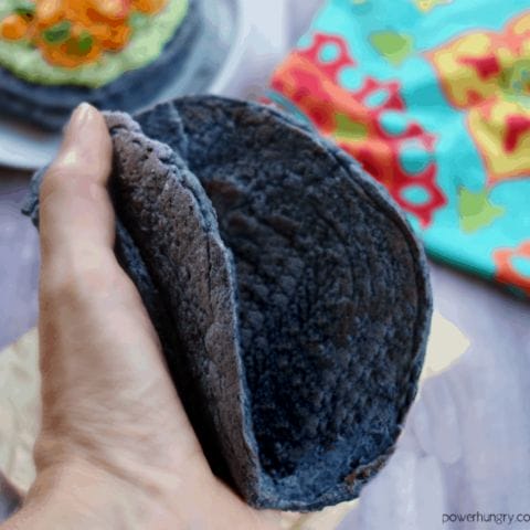 black bean tortilla bent into the shape of a taco