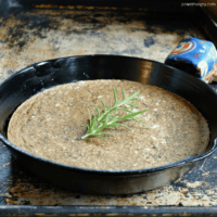 baked lentil flatbread in a cast iron skillet