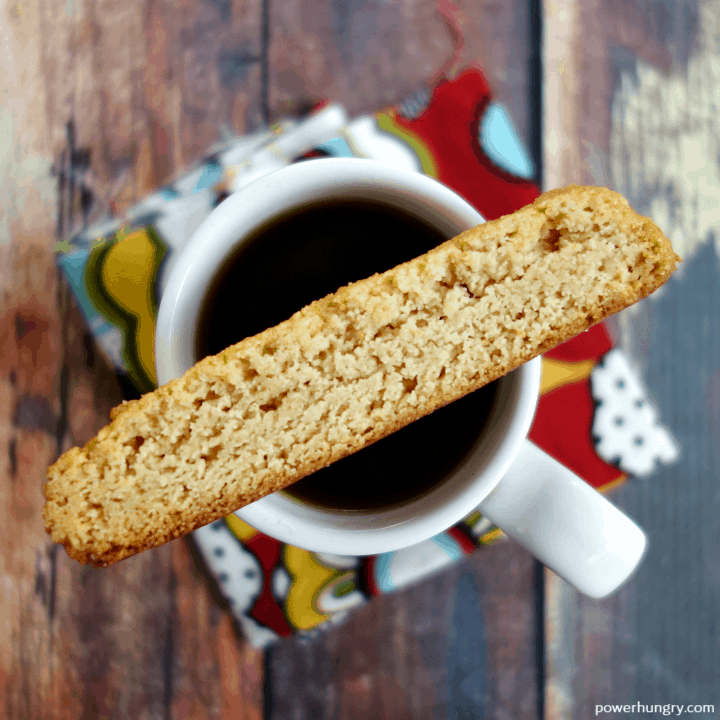 4-Ingredient Vegan Almond Flour Biscotti perched on top of a cup of espresso
