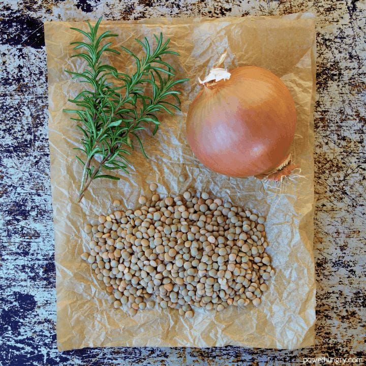 the 3 ingredients for lentil soup on a piece of brown parchment paper.