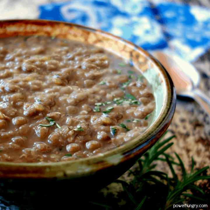 close-up of 3-ingredient lentil soup with chopped rosemary on top