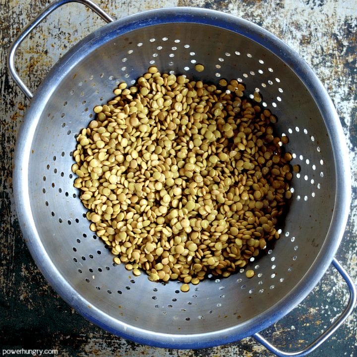 overhead view of soaked lentils in colander