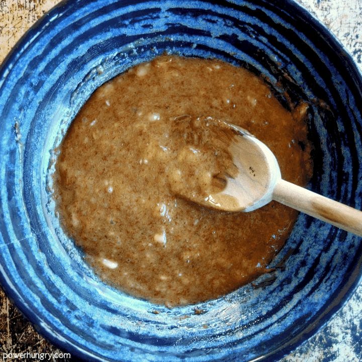 wet ingredients for banana cookies in a blue ceramic bowl