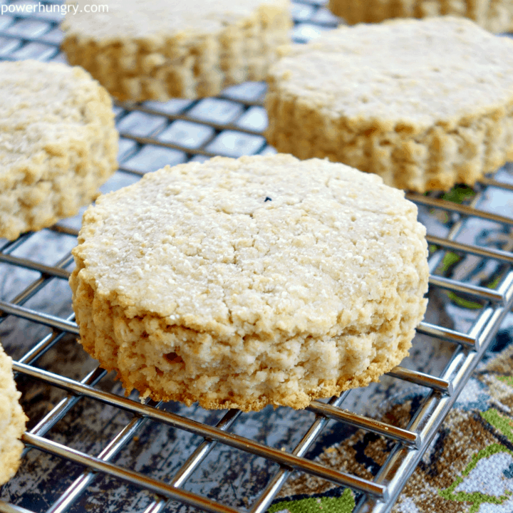 Oat and coconut flour vegan biscuits on a wire cooling rack with colorful napkin