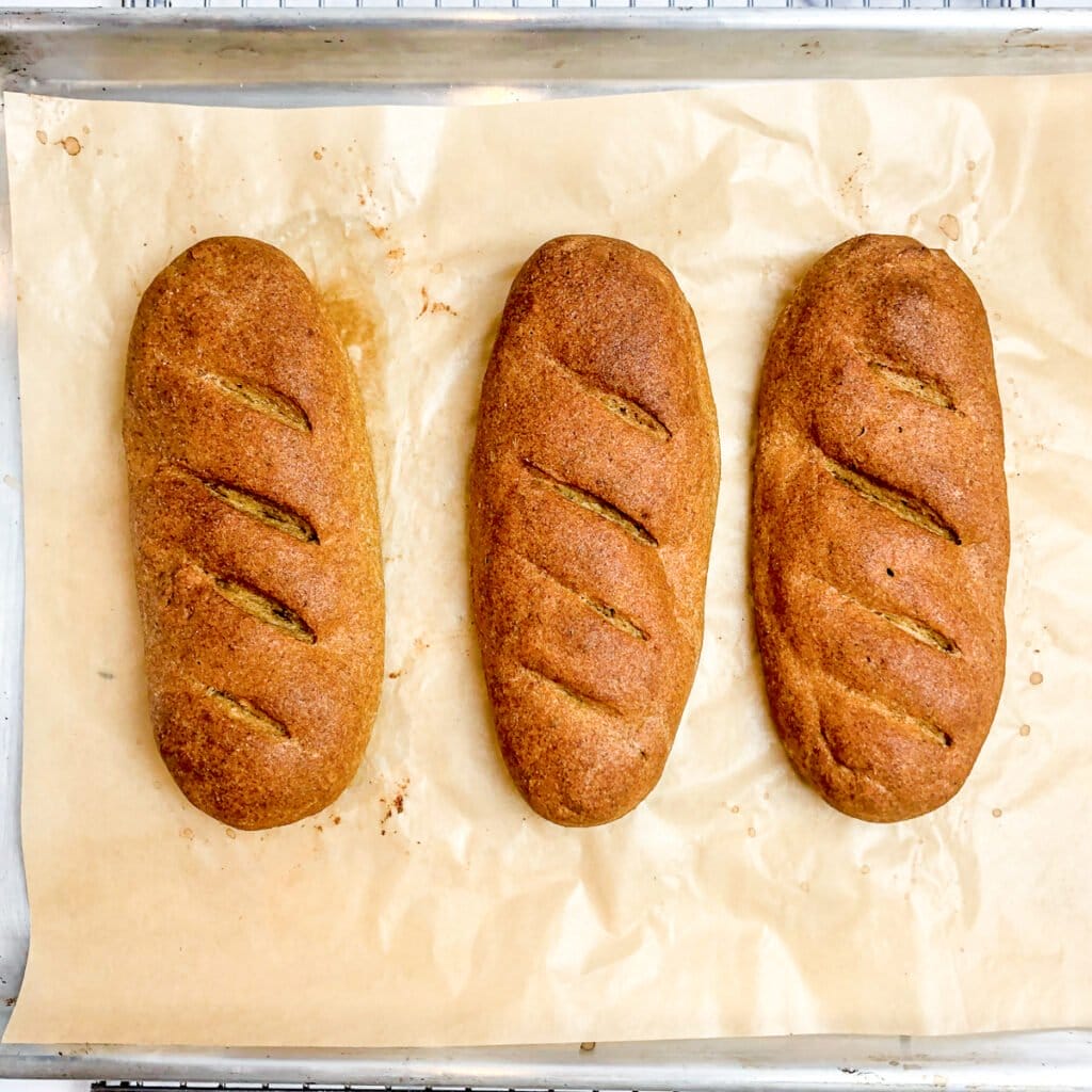 baked flax loaves on a parchment lined baking sheet