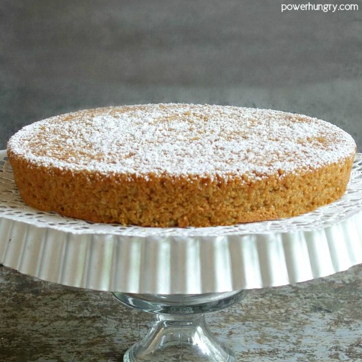 vegan almond flour cake on a cake stand