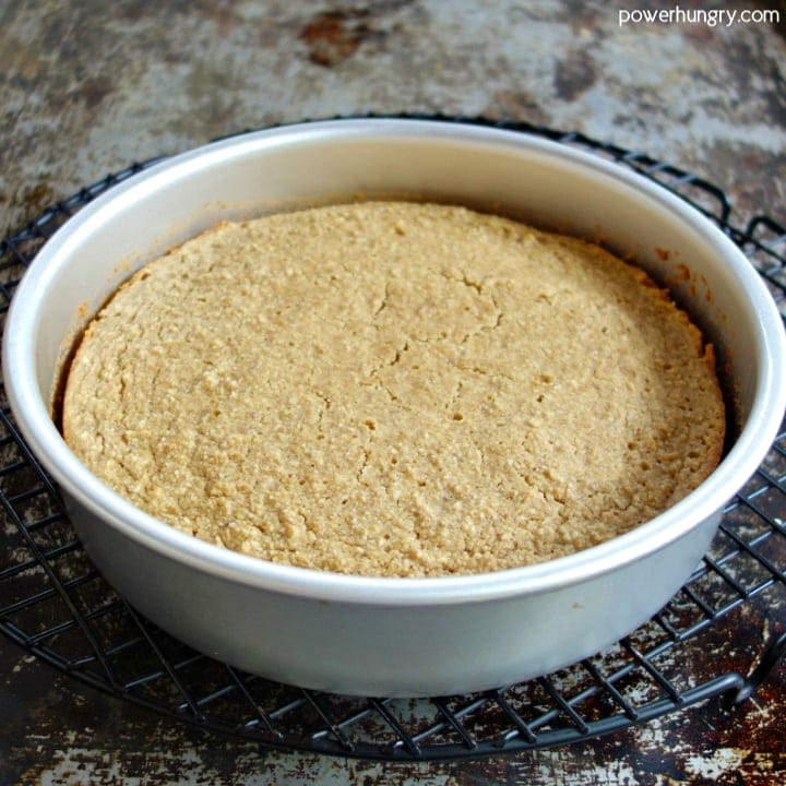 vegan almond flour cake in pan on cooling rack