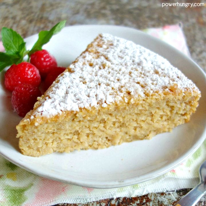 slice of vegan almond flour cake with raspberries