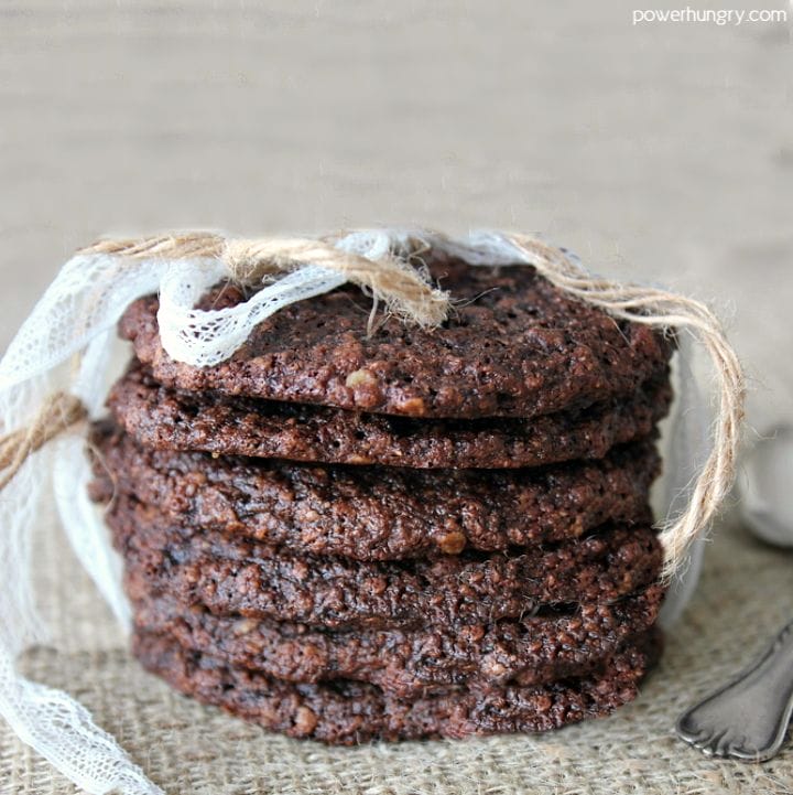 stack of double chocolate oat cookies that are vegan and gluten-free on a piece of brown burlap