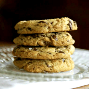 stack of 4 oil-free vegan chocolate chip cookies on a glass plate