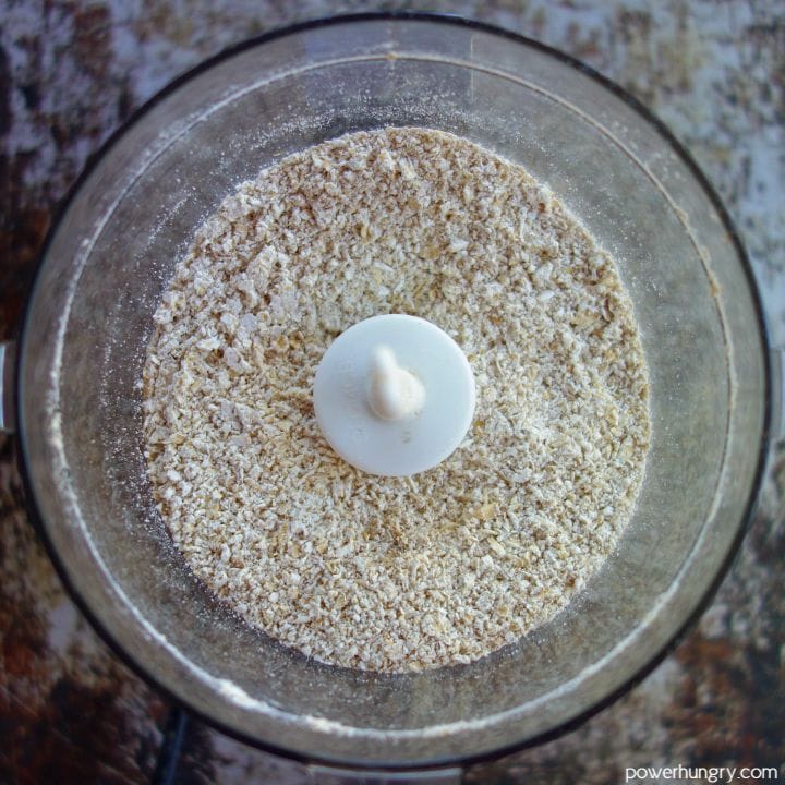 overhead shot of oats that have been ground into a rough meal in a food processor