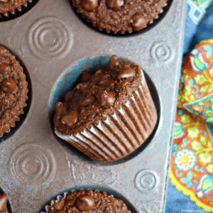 double chocolate gluten free muffins in an antique muffin tin with one muffin turned on its side