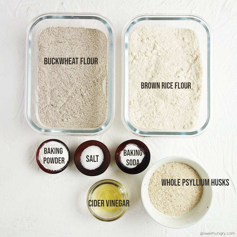 overhead shot of the ingredients to make buckwheat bread, all on a white background