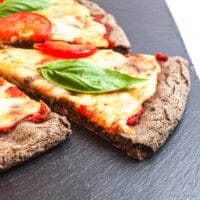 close-up of the crust edge of an easy buckwheat flour pizza crust