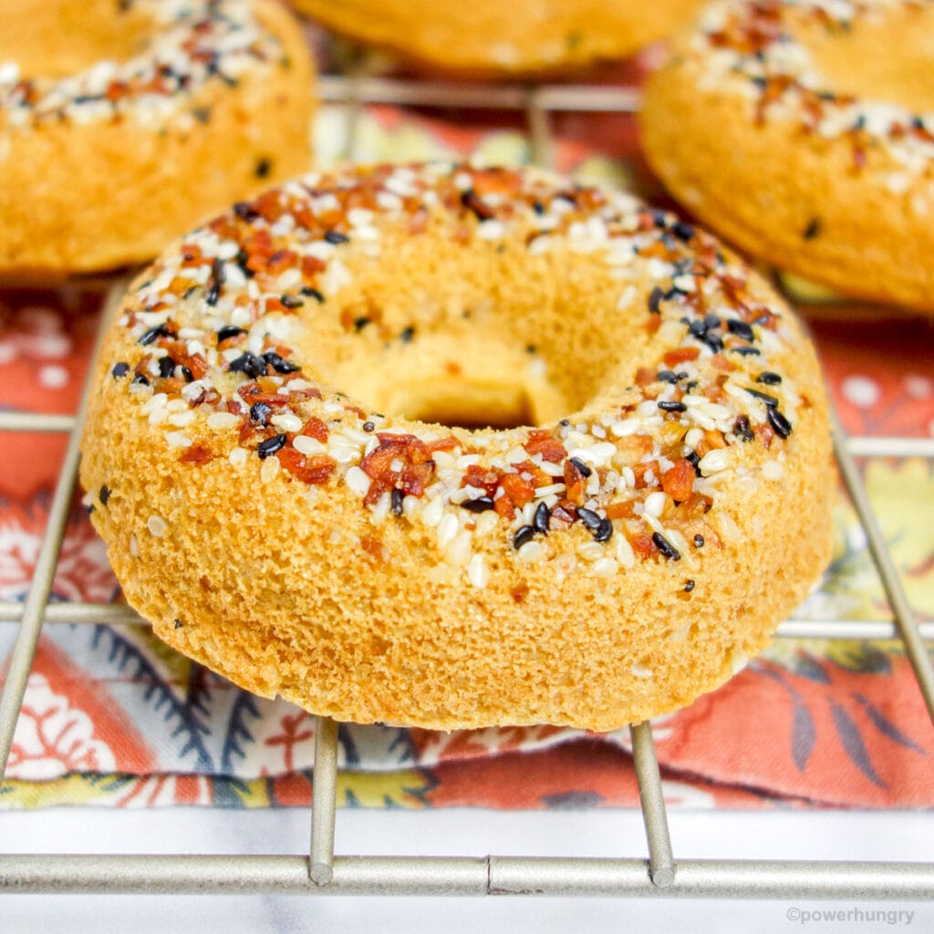 close-up of chickpea flour bagels on a gold cooling rack
