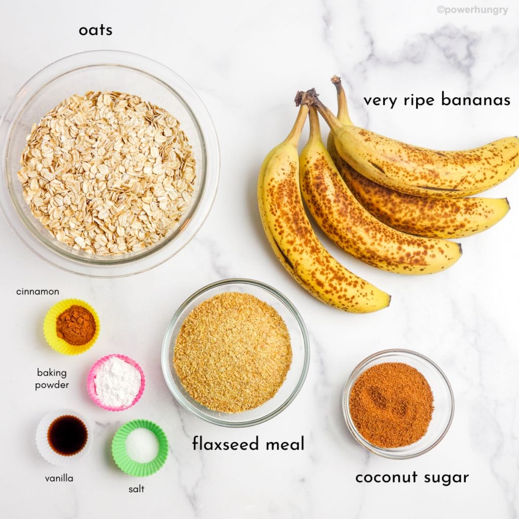 overhead shot of ingredients for oat banana bread on white marble