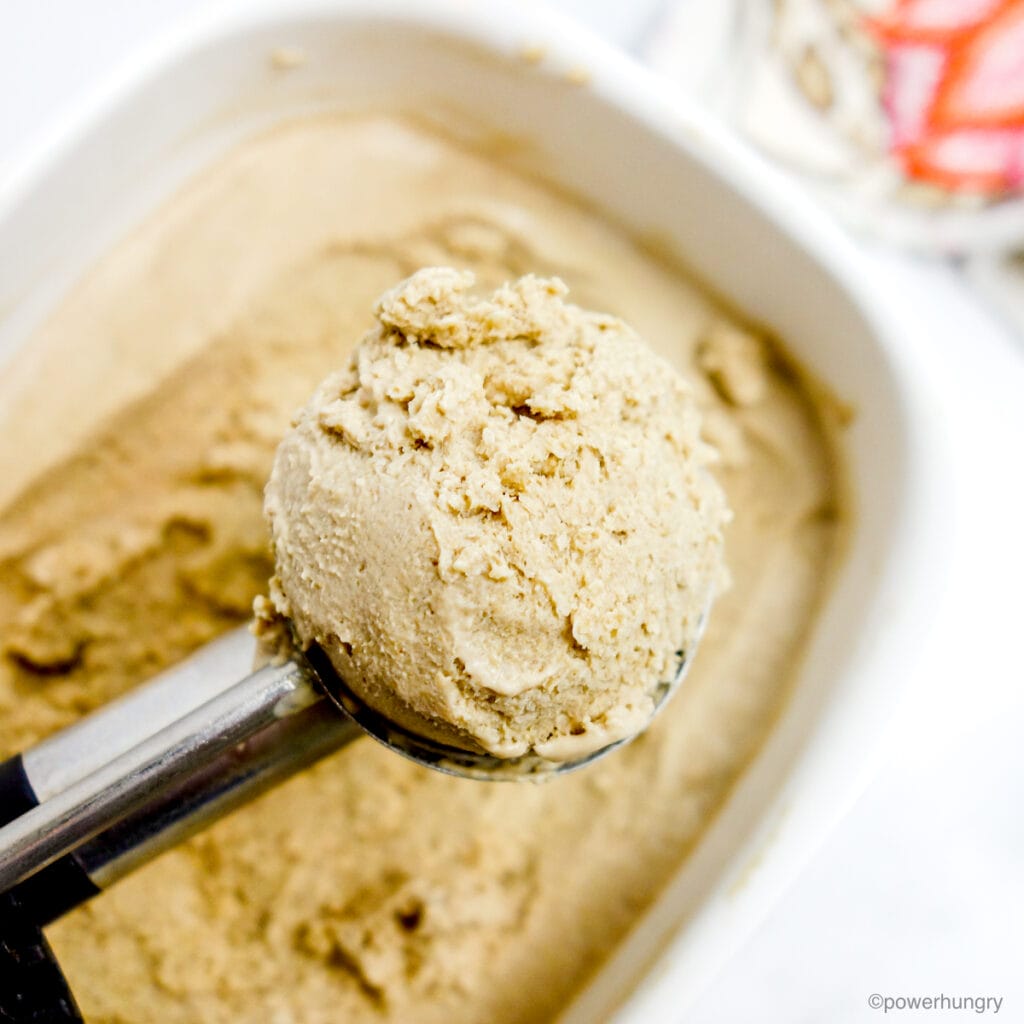 a scoop of vegan ice cream in a metal ice cream scoop