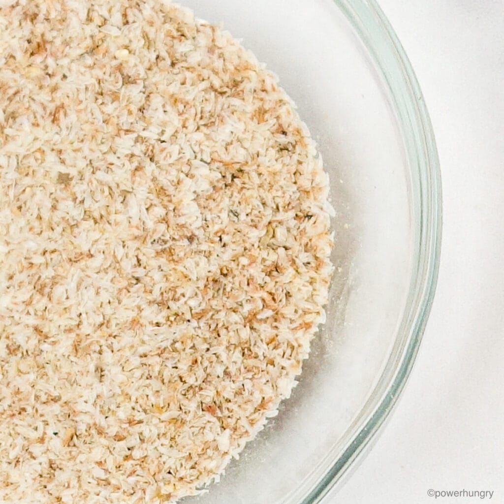 close up of a glass bowl filled with whole psyllium husks
