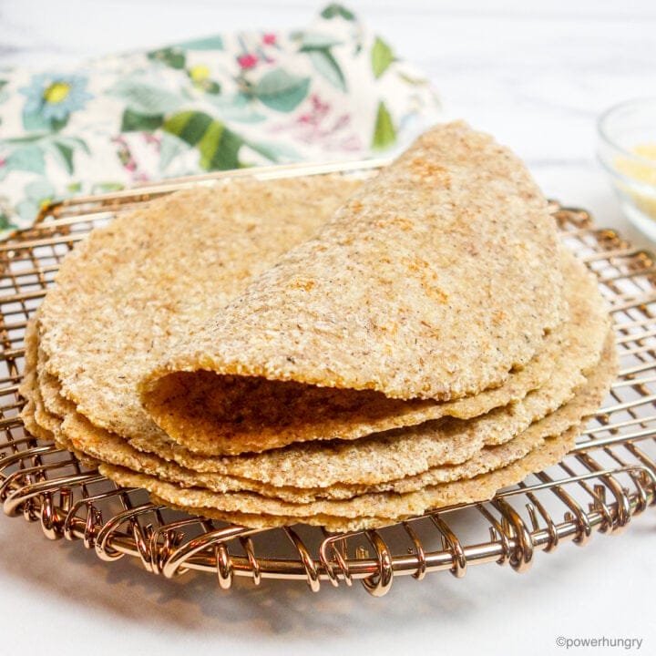 a stack of millet tortillas on a copper cooling rack