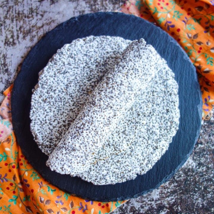 rolled coconut flour chia tortilla on a slate plate