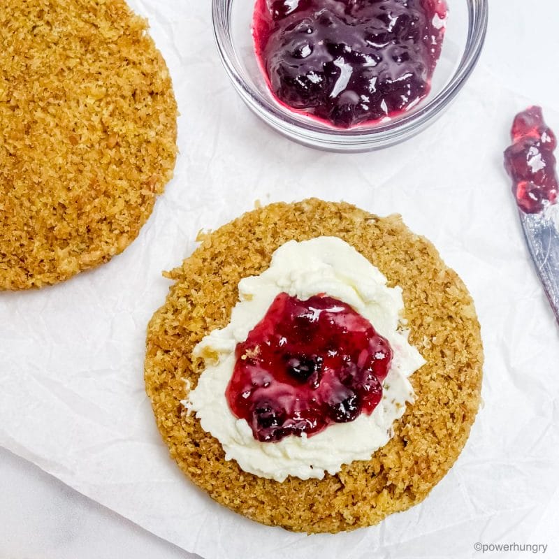sliced microwave flax bread, topped with cashew cream cheese and black currant jam