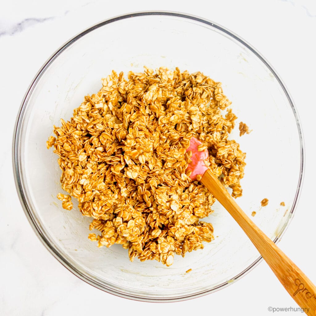 peanut butter, maple syrup and oats in a glass bowl